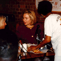 Mrs. Clinton eyes her sandwich, but doesn't bite